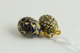 Fine russian silver gilt pair of egg pendants . Beautifully enamelled with clear white paste