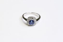18CT WHITE GOLD SAPPHIRE AND DIAMOND CLUSTER RING, sapphire weight 1.16ct. UK size M. Total weight