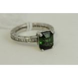 Fine 14ct gold diamond and green tourmaline ring. Engraved with a chased design throughout the