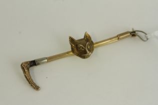 Antique 9ct gold heavy fox hunting bar brooch , marked 9ct . Measures 6.5cm in length . Weighs 6.4