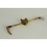 Antique 9ct gold heavy fox hunting bar brooch , marked 9ct . Measures 6.5cm in length . Weighs 6.4