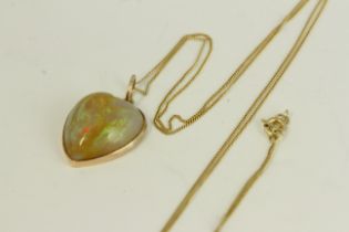 Victorian antique gold natural opal carved heart pendant necklace. Hung on a modern chain. The