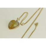 Victorian antique gold natural opal carved heart pendant necklace. Hung on a modern chain. The