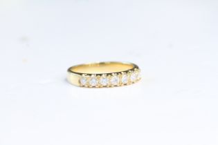 Fine 18ct gold and diamond half eternity ring. Fully hallmarked . Uk size P . Weighs 4.3 grams