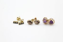 3 x 9ct gold paired gemstone stud earrings inc. sapphire, amethyst & smoky quartz (2.1g)