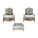 TWO SILK ARM CHAIRS AND OTTOMAN