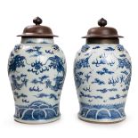 PAIR OF BLUE AND WHITE DRAGON JARS WOOD LIDS