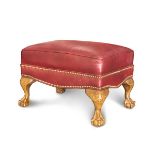 LEATHER OTTOMAN WITH CLAWED FEET