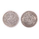 TWO CHINESE SILVER COINS