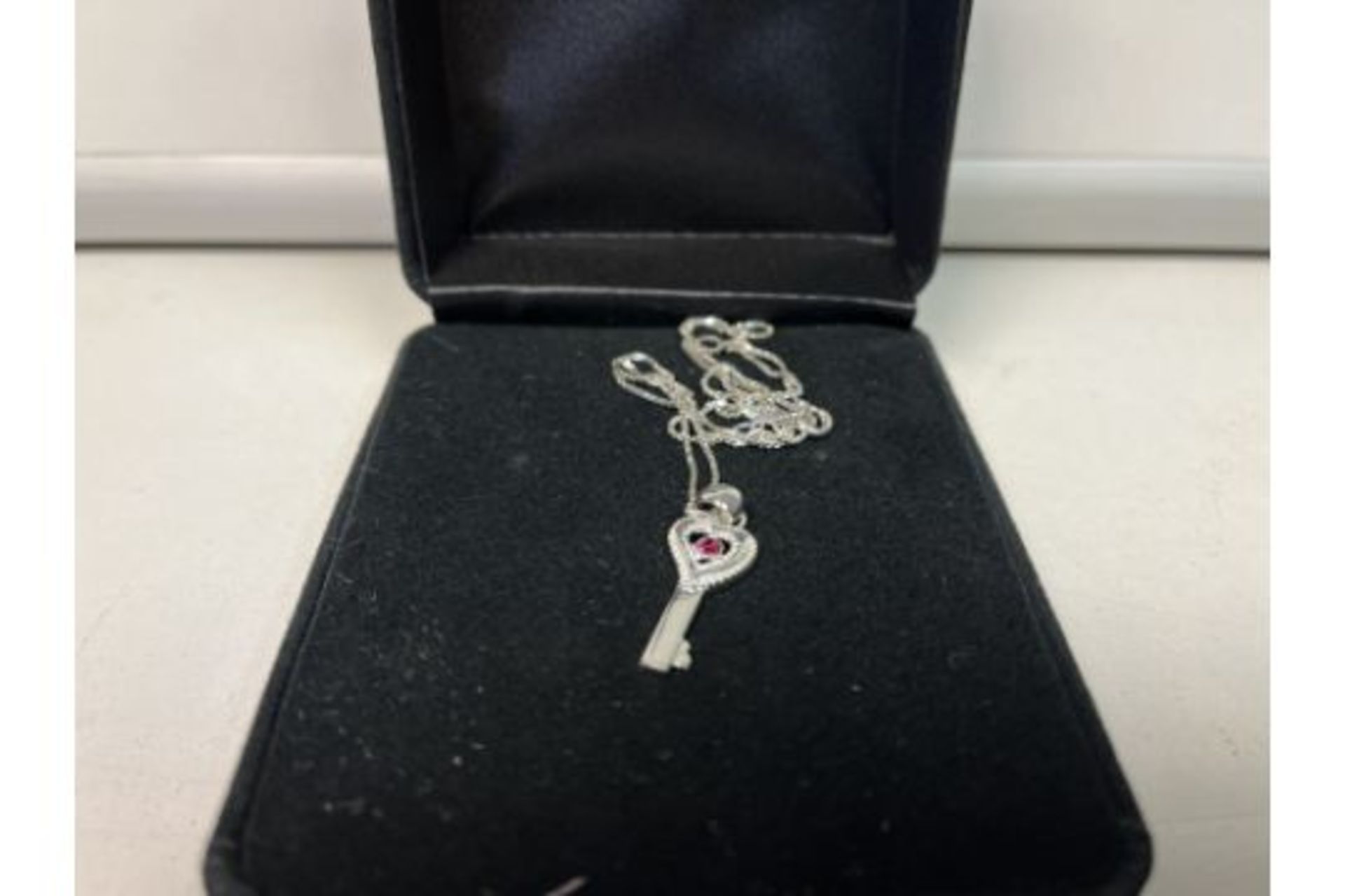 15 x NEW GIFT BOXED - GIANI JEWELLERY STERLING SILVER NECKLACE AND KEY PENDANT WITH PURPLE GEMSTONE.