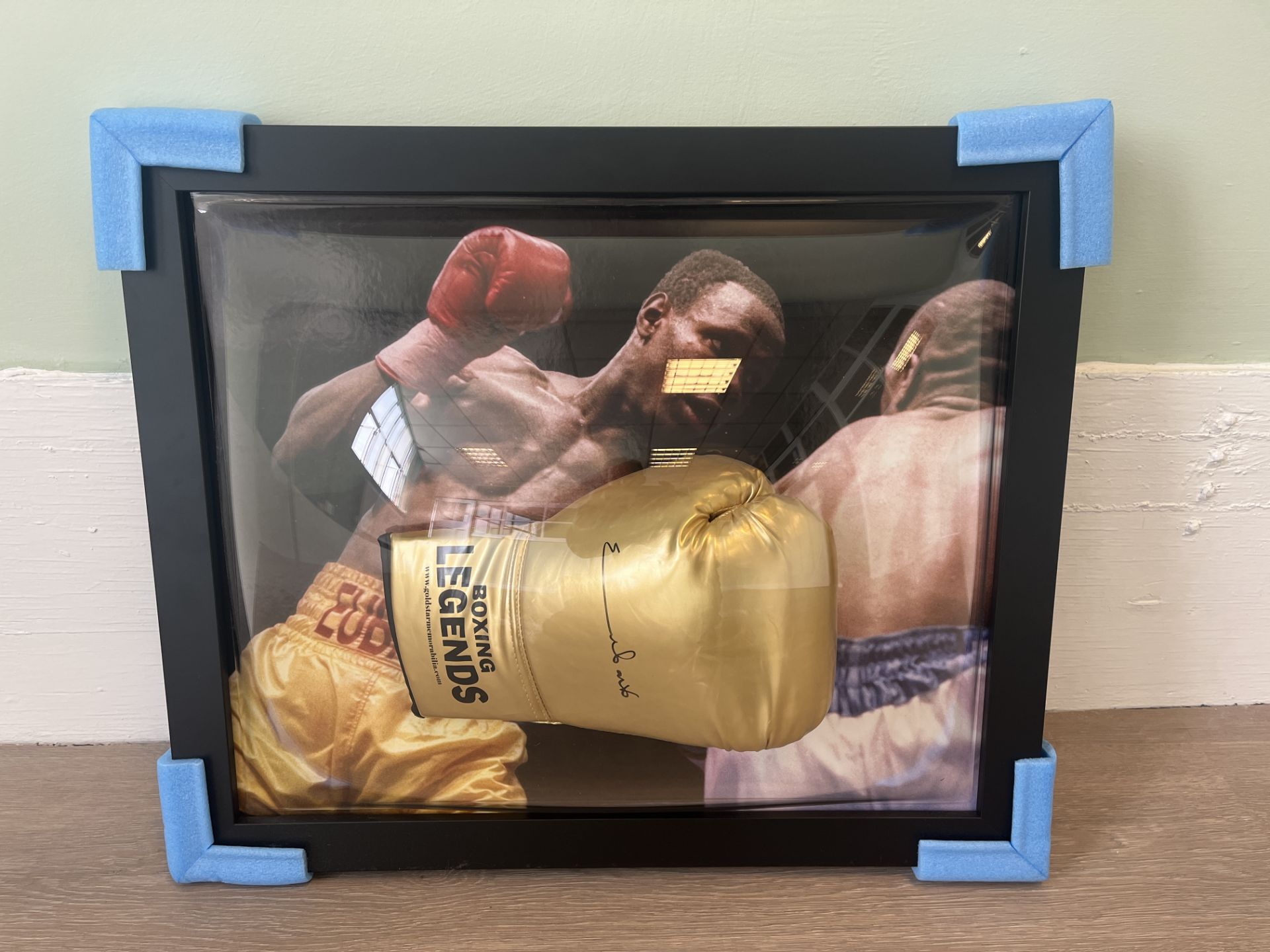 PERSONALLY SIGNED & FRAMED BOXING GLOVE FROM CHRIS EUBANK WITH A HIGHLIGHT PICTURE FROM HIS FIGHT VS