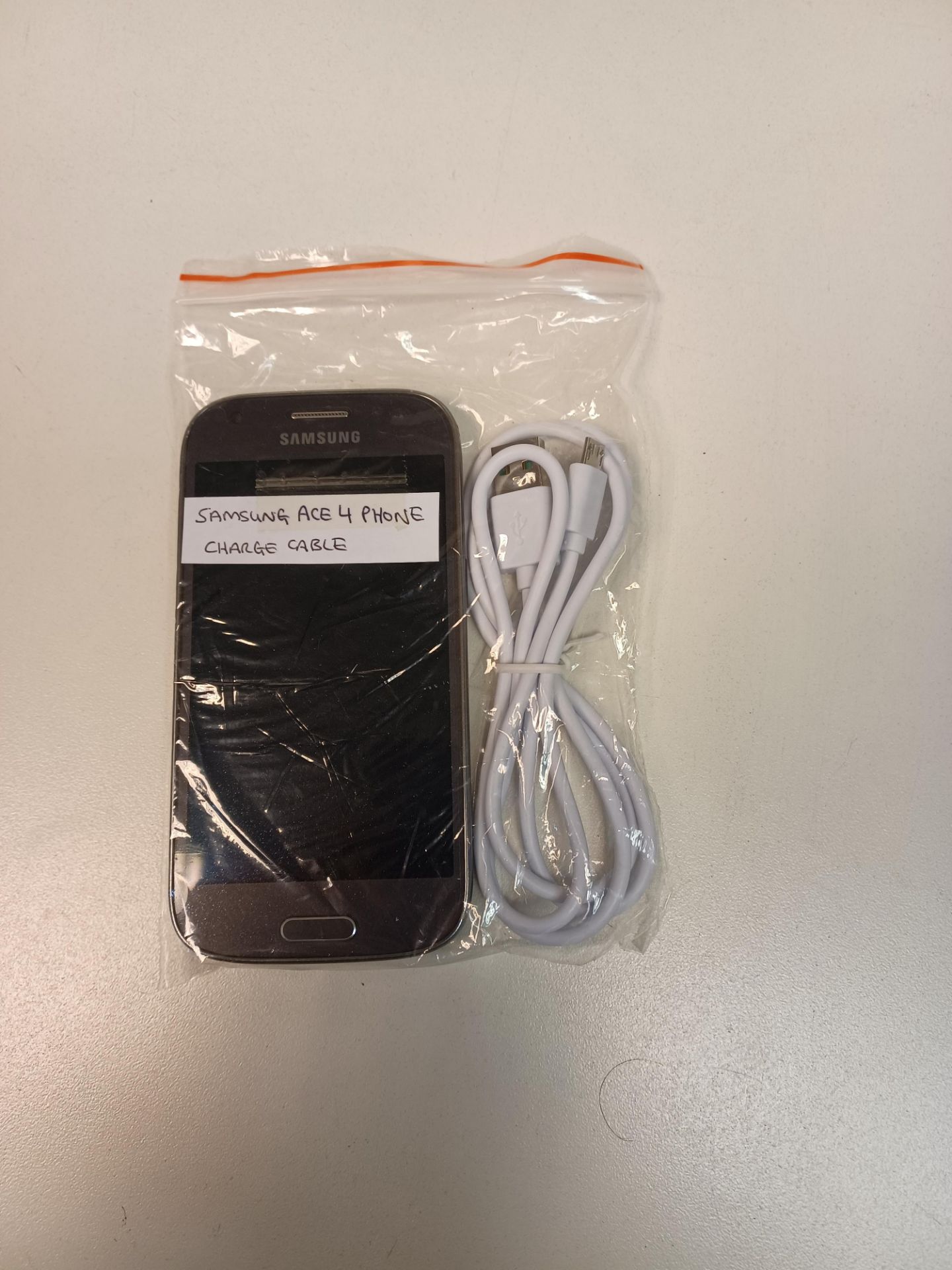 SAMSUNG ACE 4 PHONE WITH CHARGE CABLE