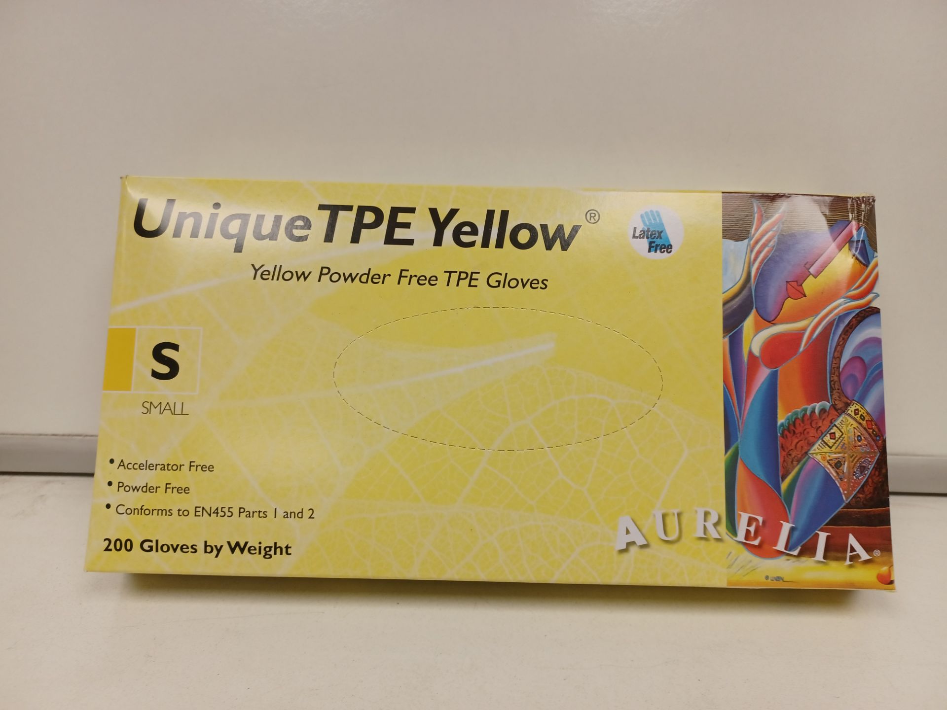 50 X BOXES OF 200 GLOVES. UNIQUES TPE YELLOW. SIZE SMALL. ROW 1