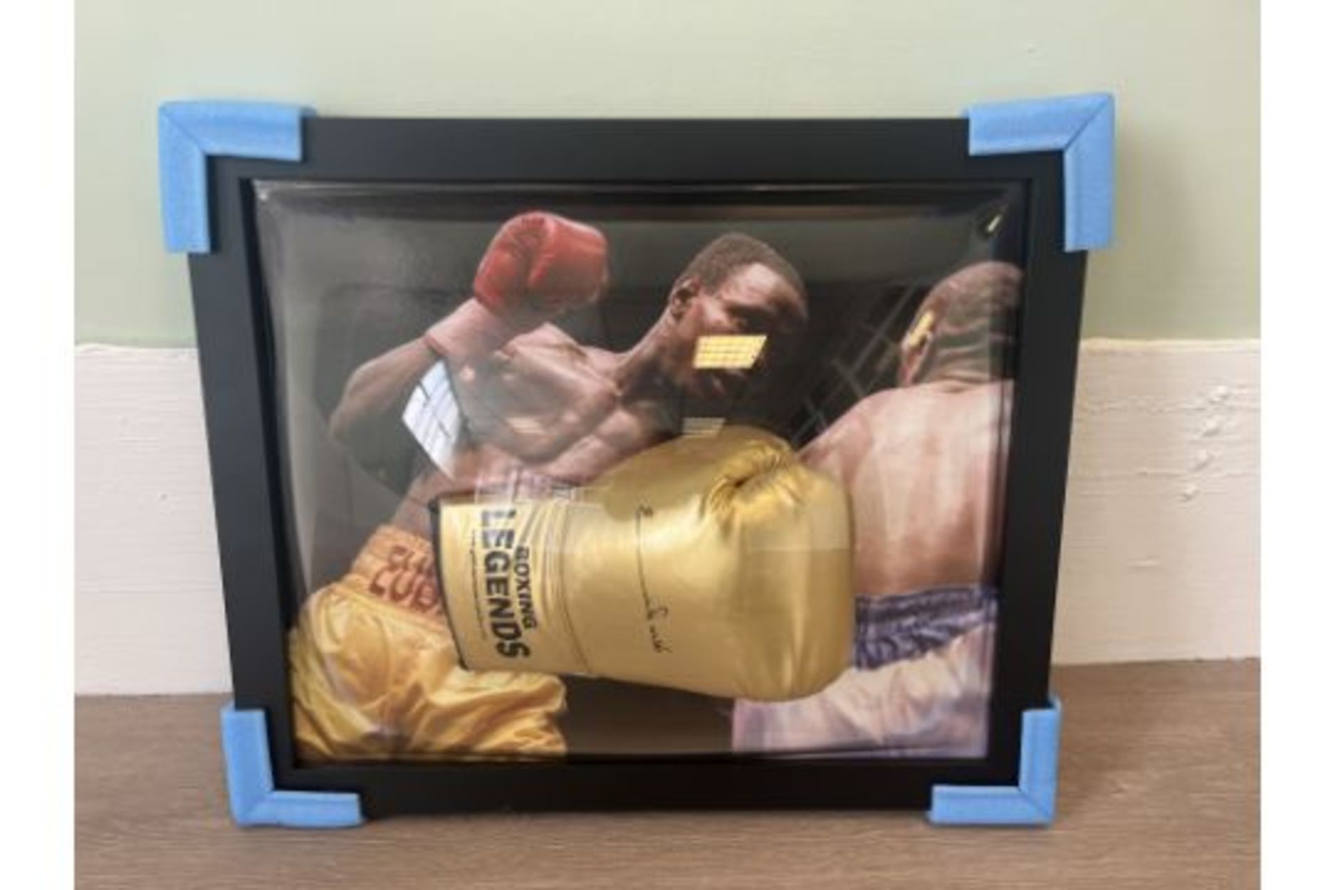 PERSONALLY SIGNED & FRAMED BOXING GLOVE FROM CHRIS EUBANK WITH A HIGHLIGHT PICTURE FROM HIS FIGHT VS