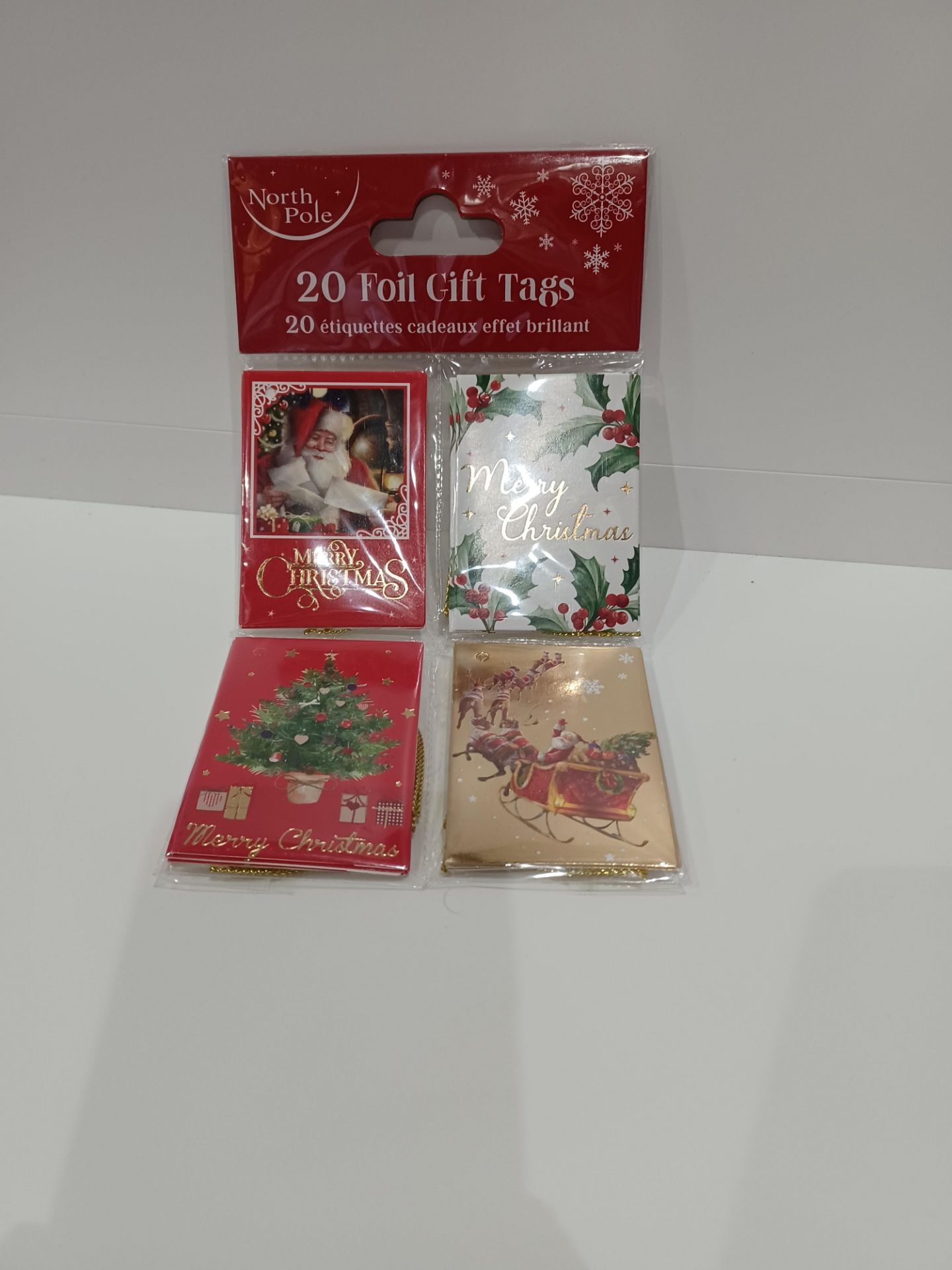 96 X NEW PACKAGED PACKS OF 20 NORTH POLE FOIL GIFT TAGS. ROW 15 B/W