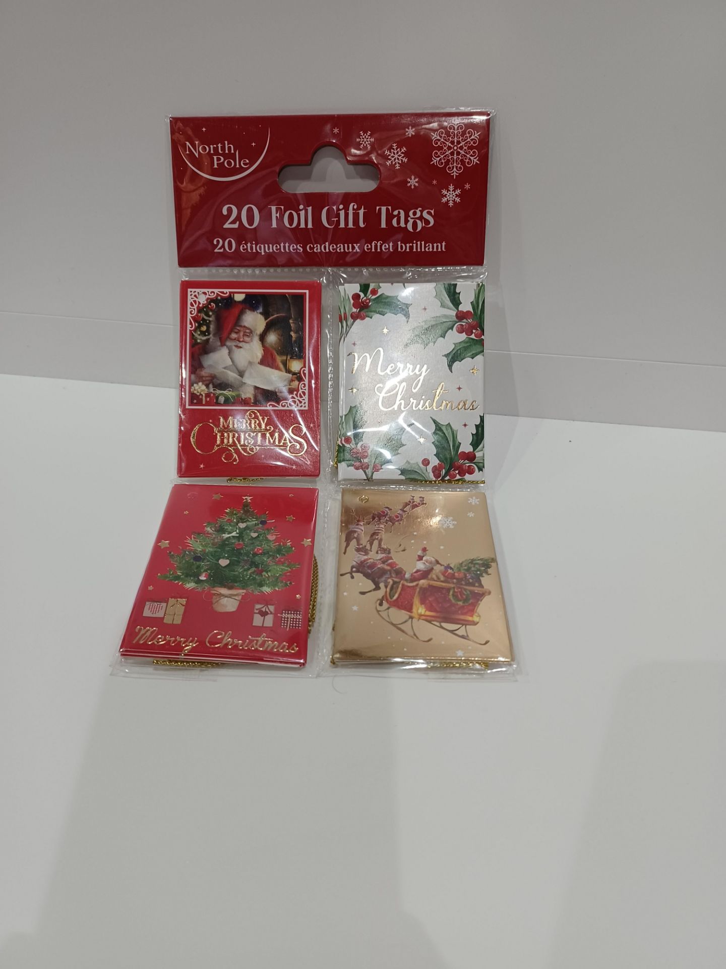 96 X NEW PACKAGED PACKS OF 20 NORTH POLE FOIL GIFT TAGS. ROW 15 B/W