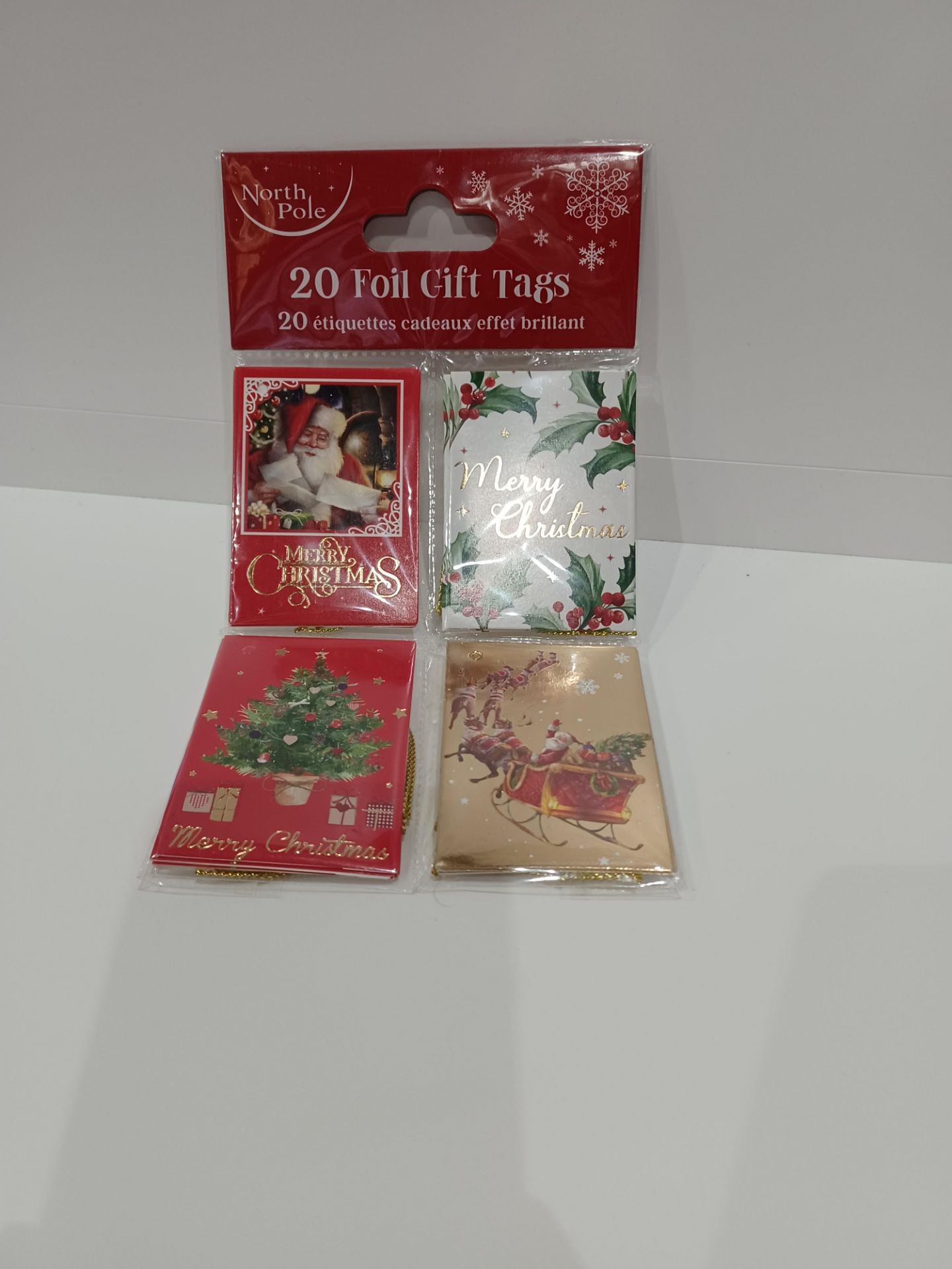 96 X NEW PACKAGED PACKS OF 20 NORTH POLE FOIL GIFT TAGS. ROW 15 B/W