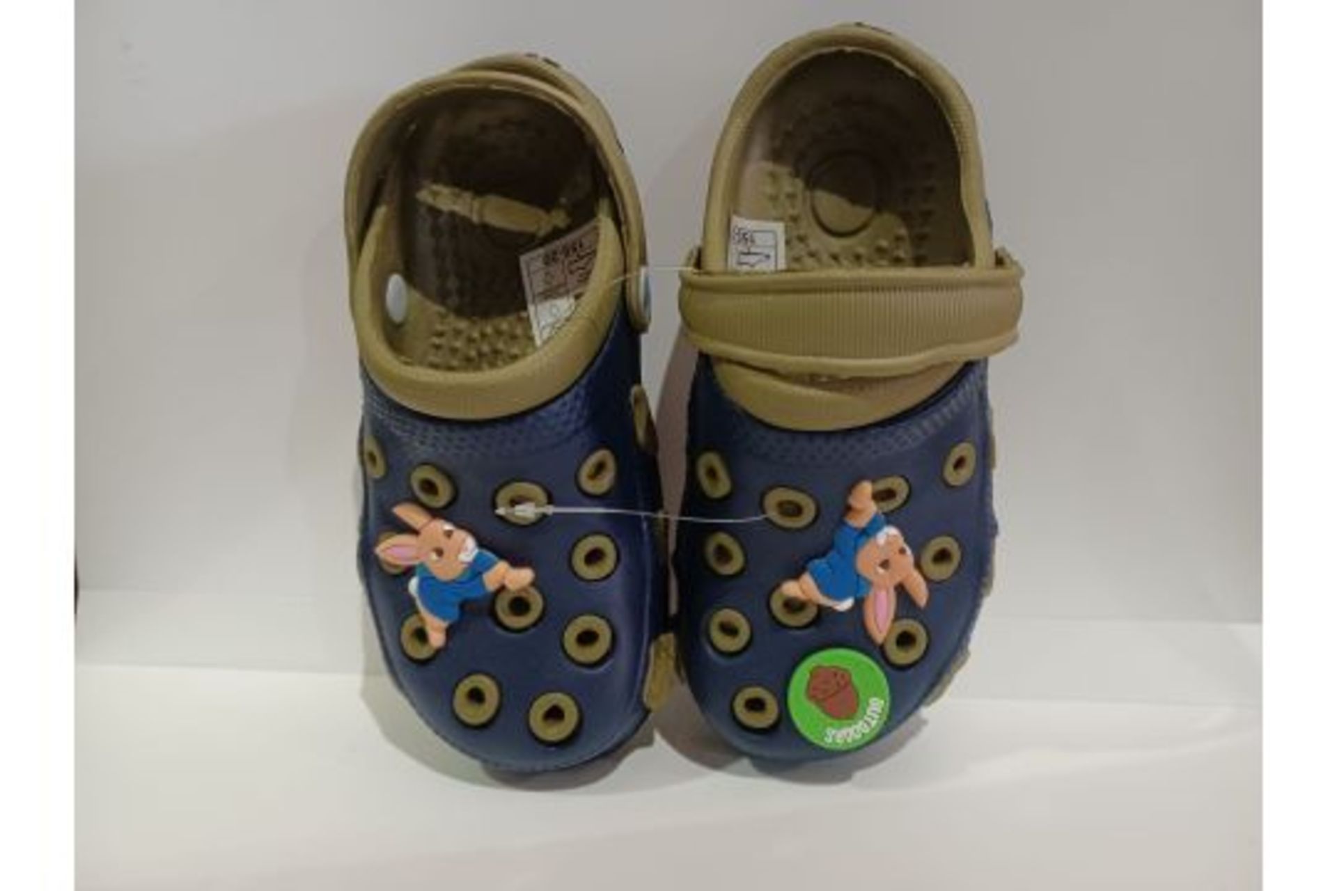TRADE LOT 108 X NEW PACKAGED PAIRS OF PETER THE RABIT CLOGS STYLE CHILDRENS SHOES. ROW 3RACK