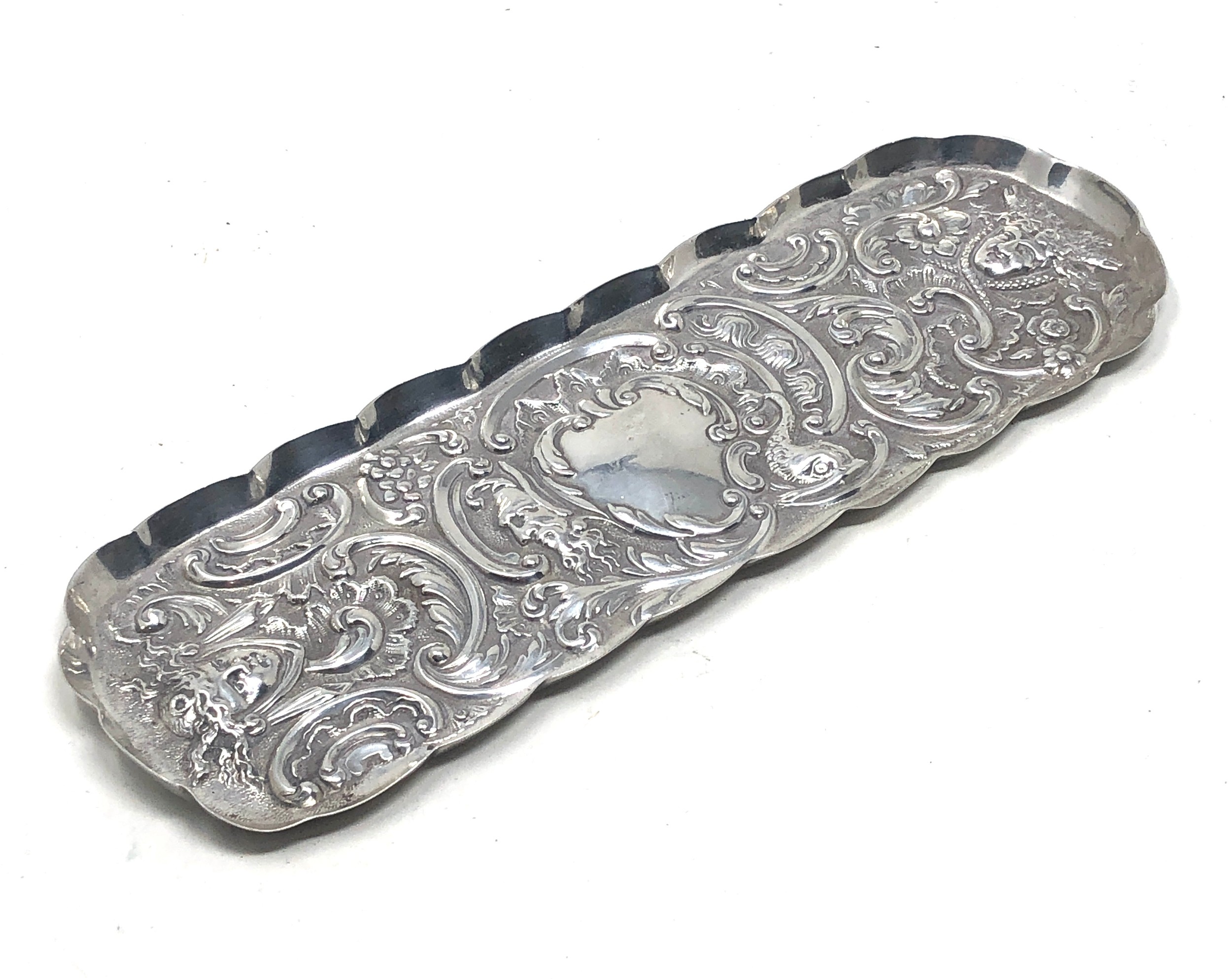 Antique chased silver pin tray measures approx 20.5cm by 7cm