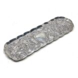 Antique chased silver pin tray measures approx 20.5cm by 7cm