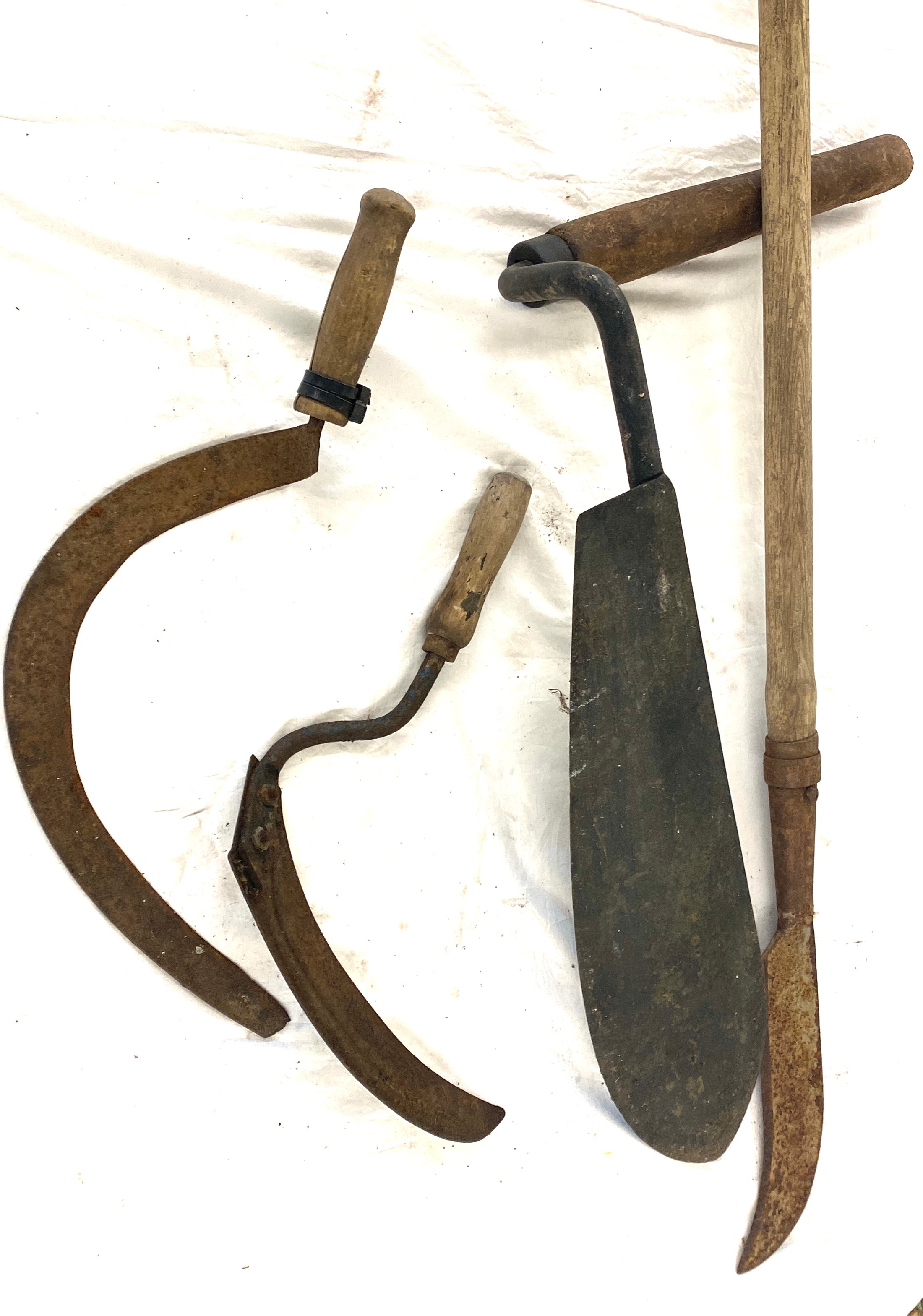 Selection of vintage grass cutting implements