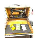 Cased vintage singer sewing machine