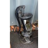 Cast iron water pump, approximate height 21 inches