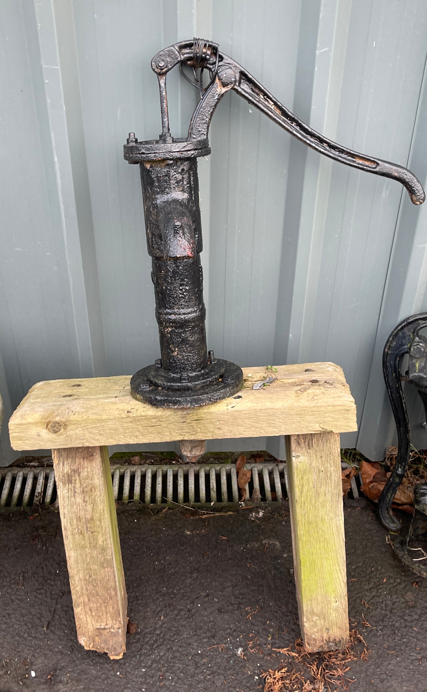 Water pump on wooden stand, approximate height with stand 42 inches