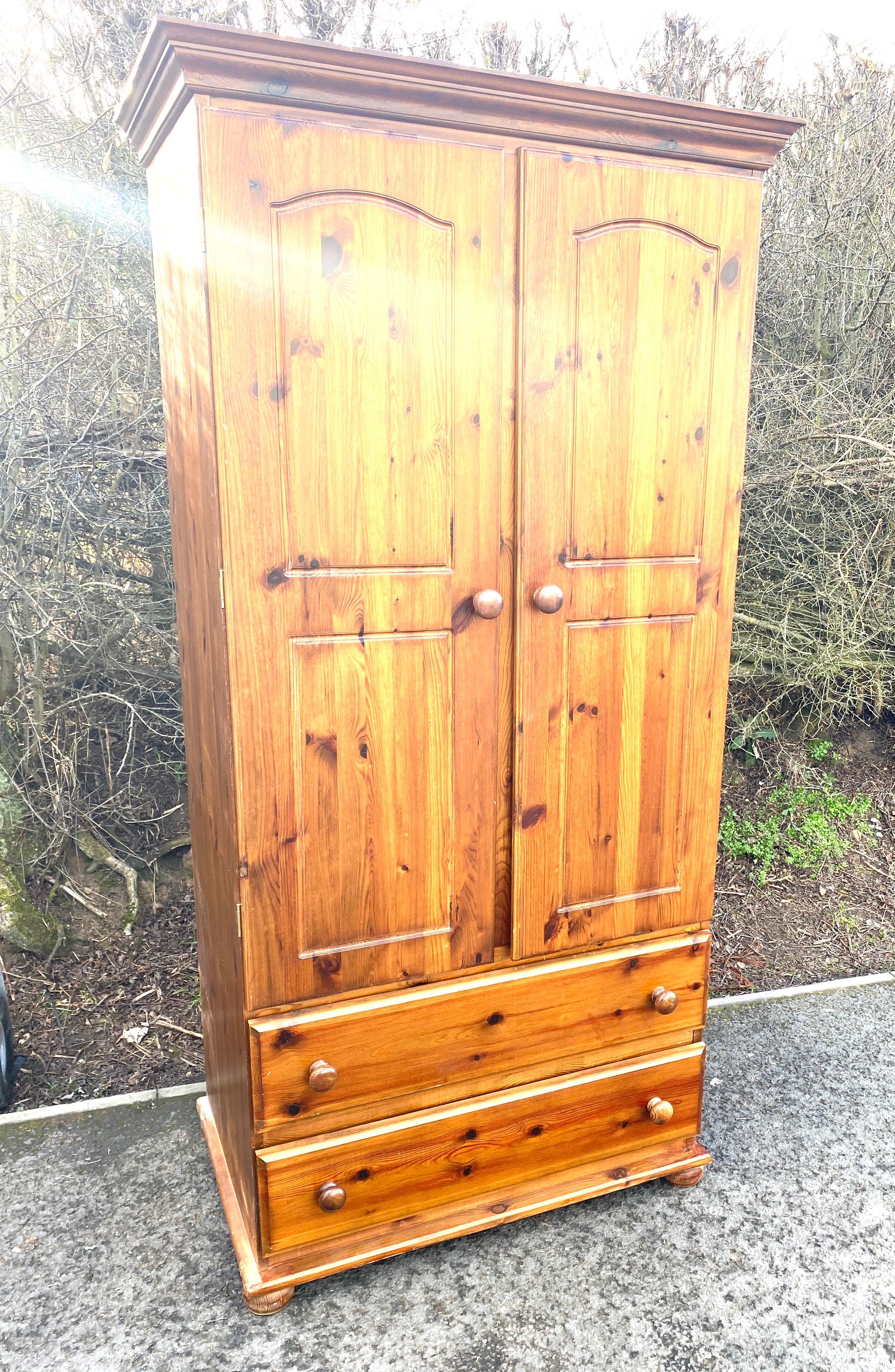 Pine 2 door 2 draw robe measures approx 72" tall 36" wide 22.5" depth