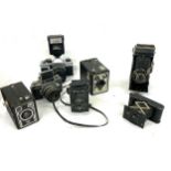 Selectrion of vintage camera to include Praktica MTL 5, Exa, Ilfoflox, Kodak A127, Brownie, Agfa,