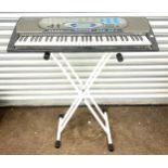 Casio keyboard on stand, model number CTK_571, working order