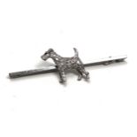 An antique 15 ct white gold & 18ct white gold & diamond fox terrier bar brooch; set throughout