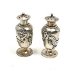 Antique pair of chinese silver dragon pepper pots each measure approx 8cm tall total weight 102g