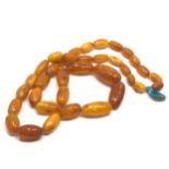 An antique butterscotch / egg yolk amber bead necklace, weight Approx. 58.7 grams.