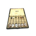 A set of six antique silver spoons made by Liberty & Co, with polished hardstone agate tops in