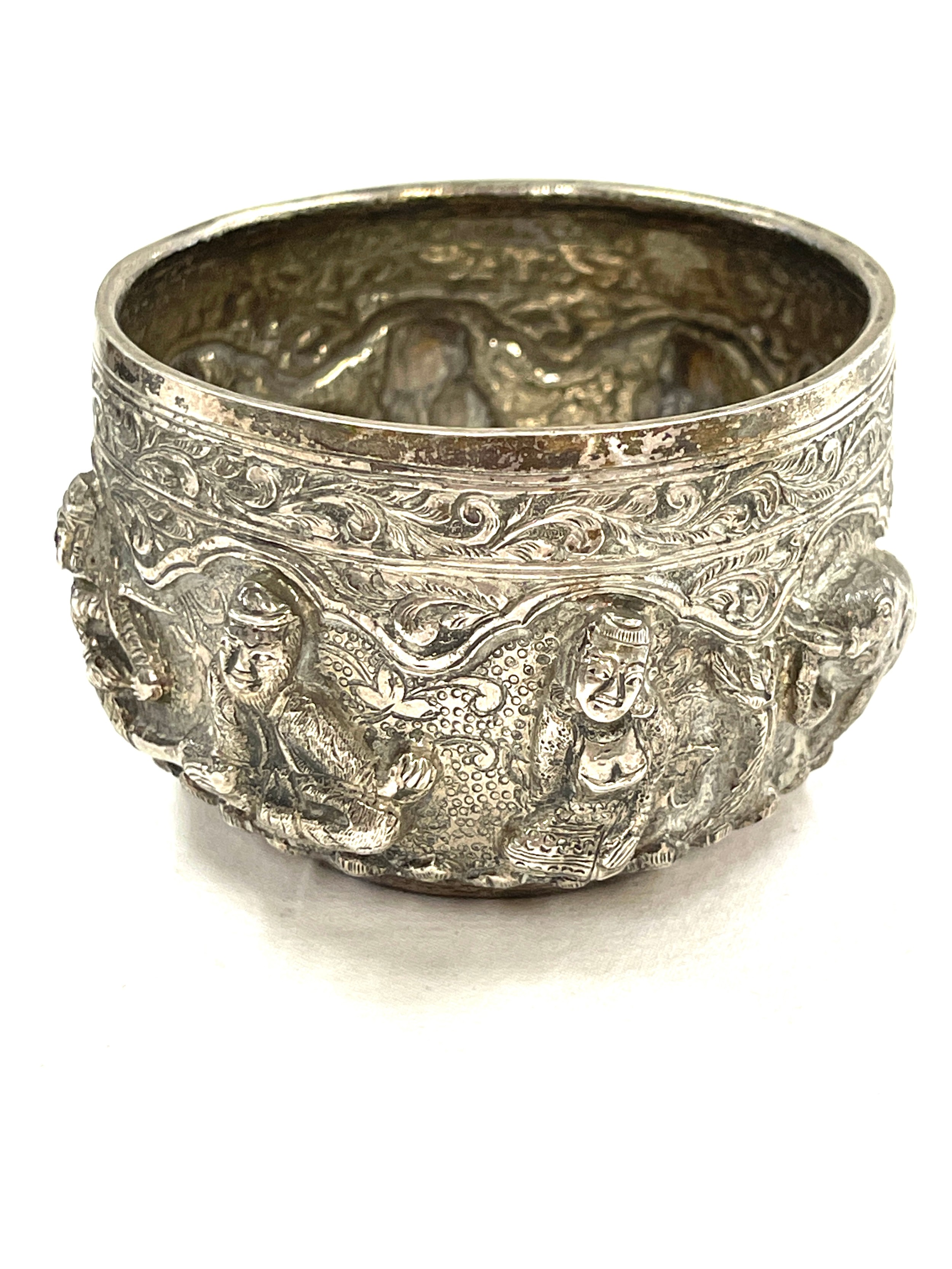 A pair of Burmese silver rice bowls embossed in high relief with Buddhas, figures, trees and - Image 5 of 7