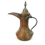 Middle eastern Dallah Arabic copper coffee pot, approximate height 13 inches