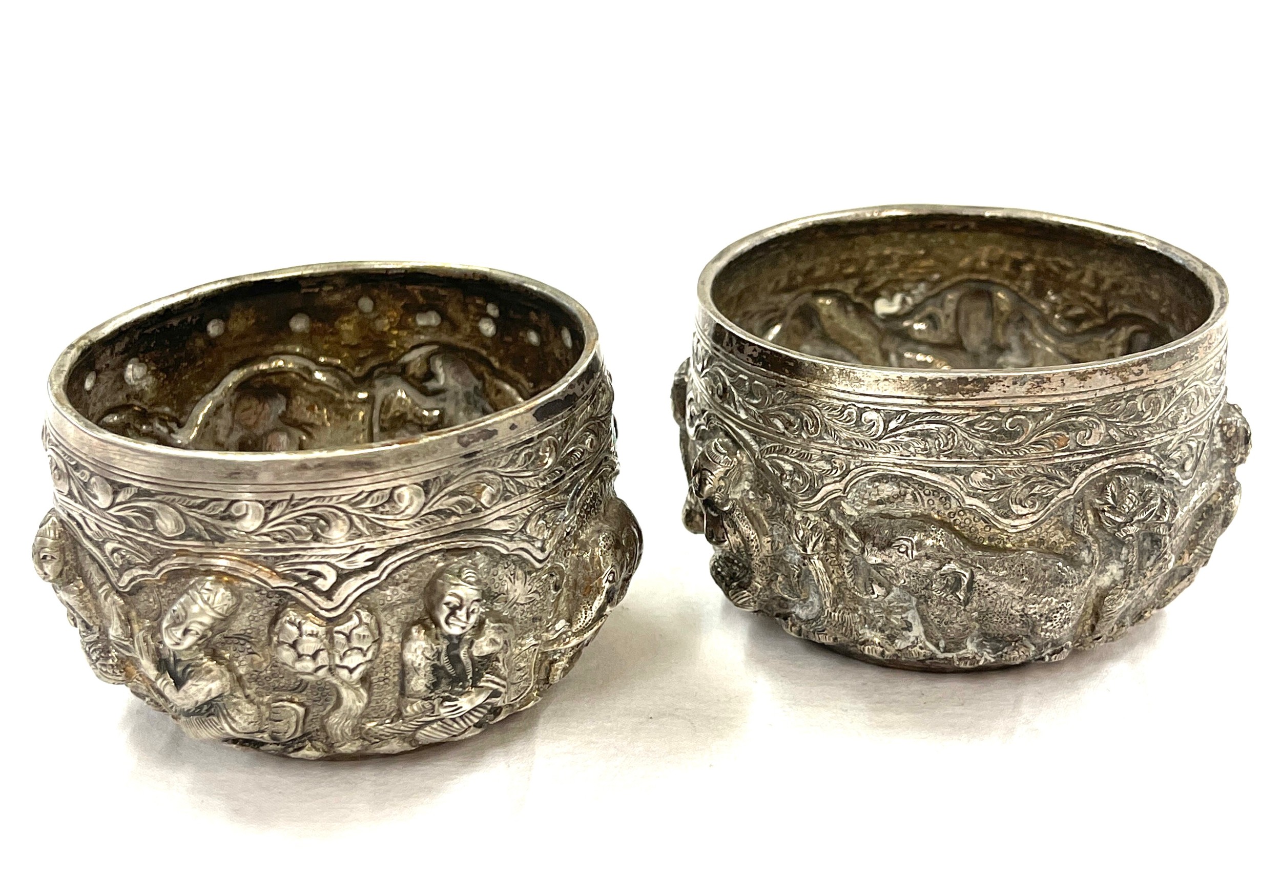 A pair of Burmese silver rice bowls embossed in high relief with Buddhas, figures, trees and - Image 7 of 7