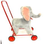Vintage 1970s stuffed elephant on wheels