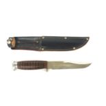 Bowie knife in leather shealth
