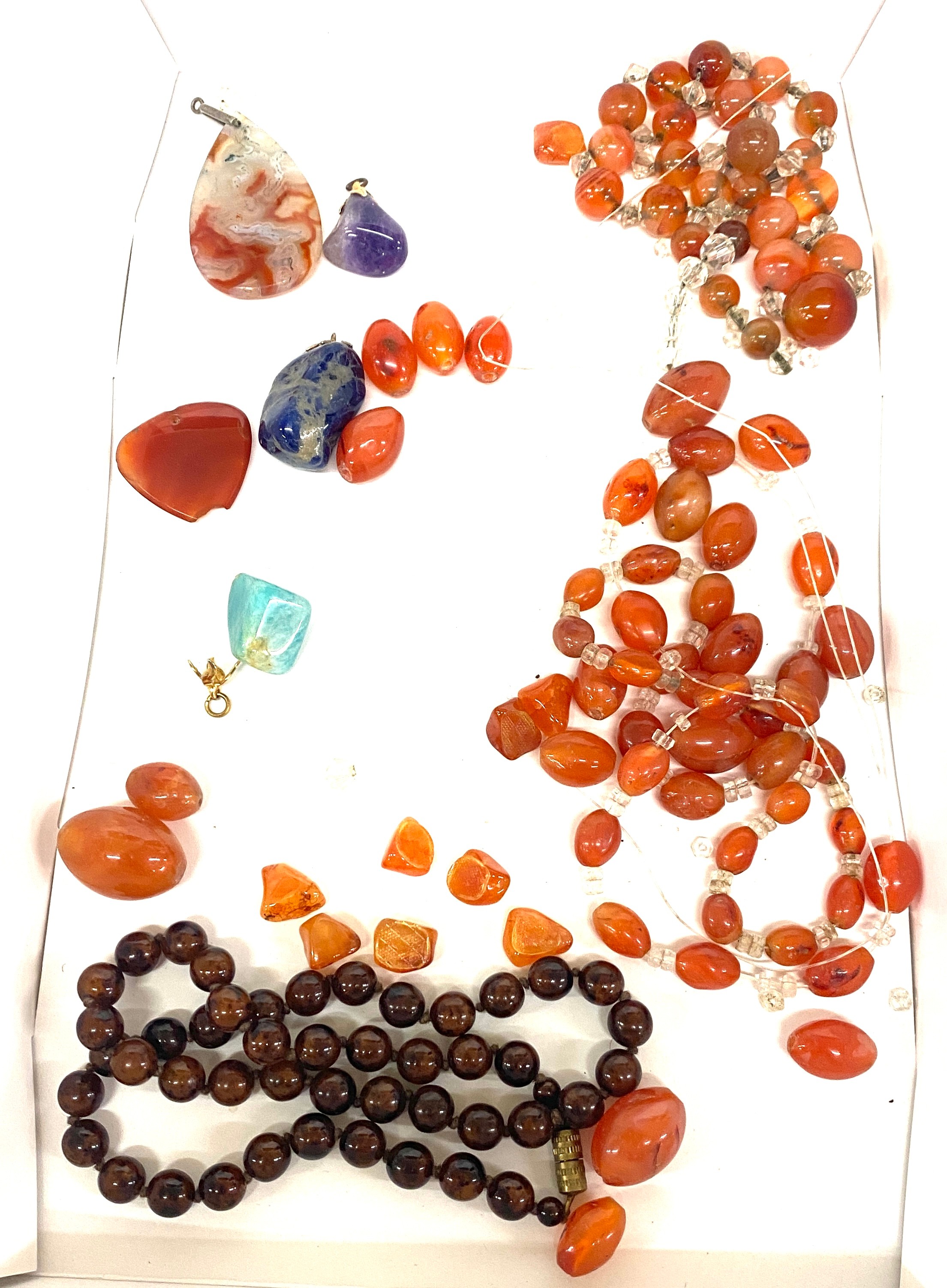 Ladies amber and agate vintage necklaces, both in need of repair, stone pendants