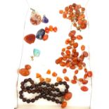Ladies amber and agate vintage necklaces, both in need of repair, stone pendants