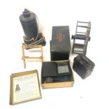 Selection of vintage camera equipment includes pathe camera , kodak film tank Agrandisseur plant