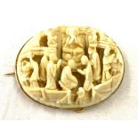 Antique carved ivory antique brooch set in gold