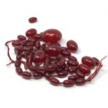 Antique loose cherry amber bakelite graduated beads with internal streaking, 54.6g