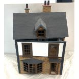 Dolls house together with a selection of dolls house furniture, house measures approximately Height: