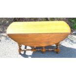 Ercol drop leaf coffee table bobbin legged, 36" wide 42" long ( when opened) 19" tall