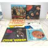 Selection 8 Records / vinyls to include Sgt Pepper The Beatles, Rubber Soul, Wings at the speed of