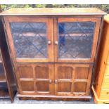 Oak 4 door glazed bookcase measures approx 43" tall 36" wide 12.5' depth