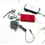 Nintendo DS lite and 7 games with charger and case